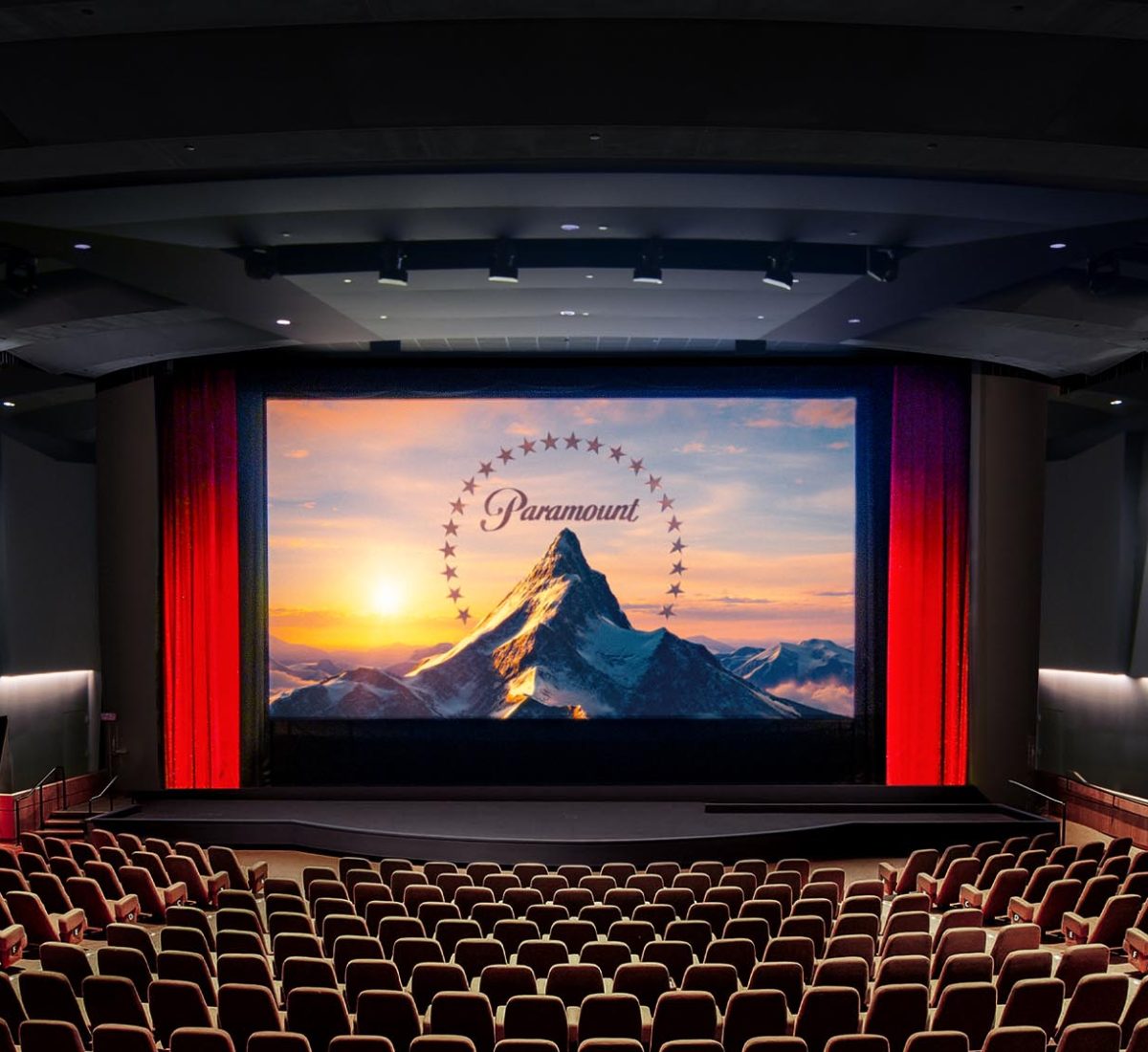 Sleek black sports car being polished in a workshop setting. Ideal for creative and business use